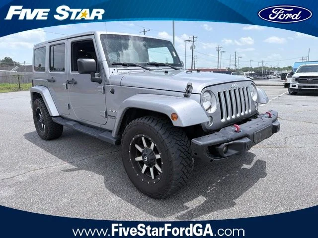 Used 2016 Billet Silver Metallic Jeep Unlimited Sahara image 1