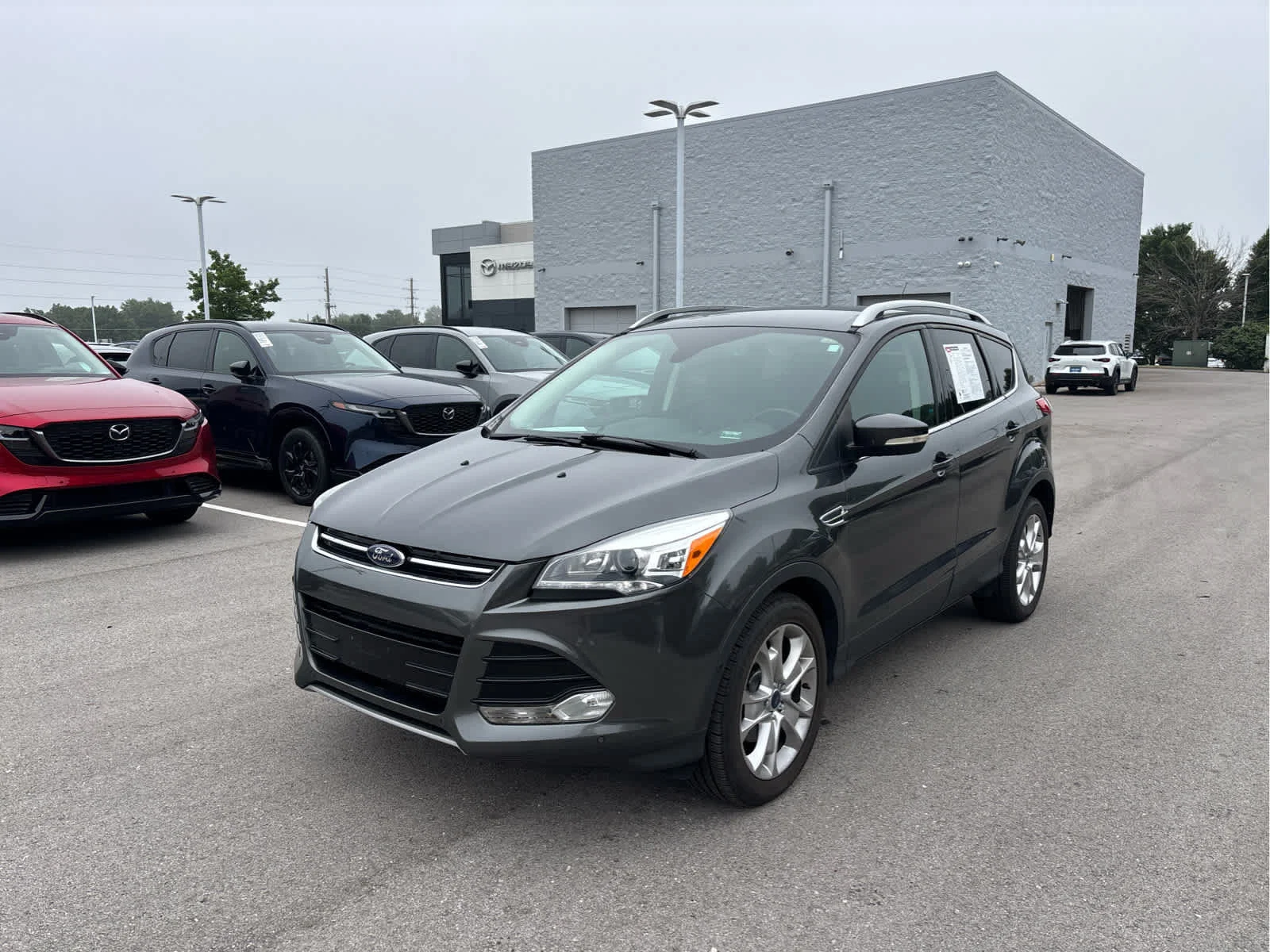 Used 2016 Ford Escape Titanium with VIN 1FMCU0JX5GUB69524 for sale in Kansas City