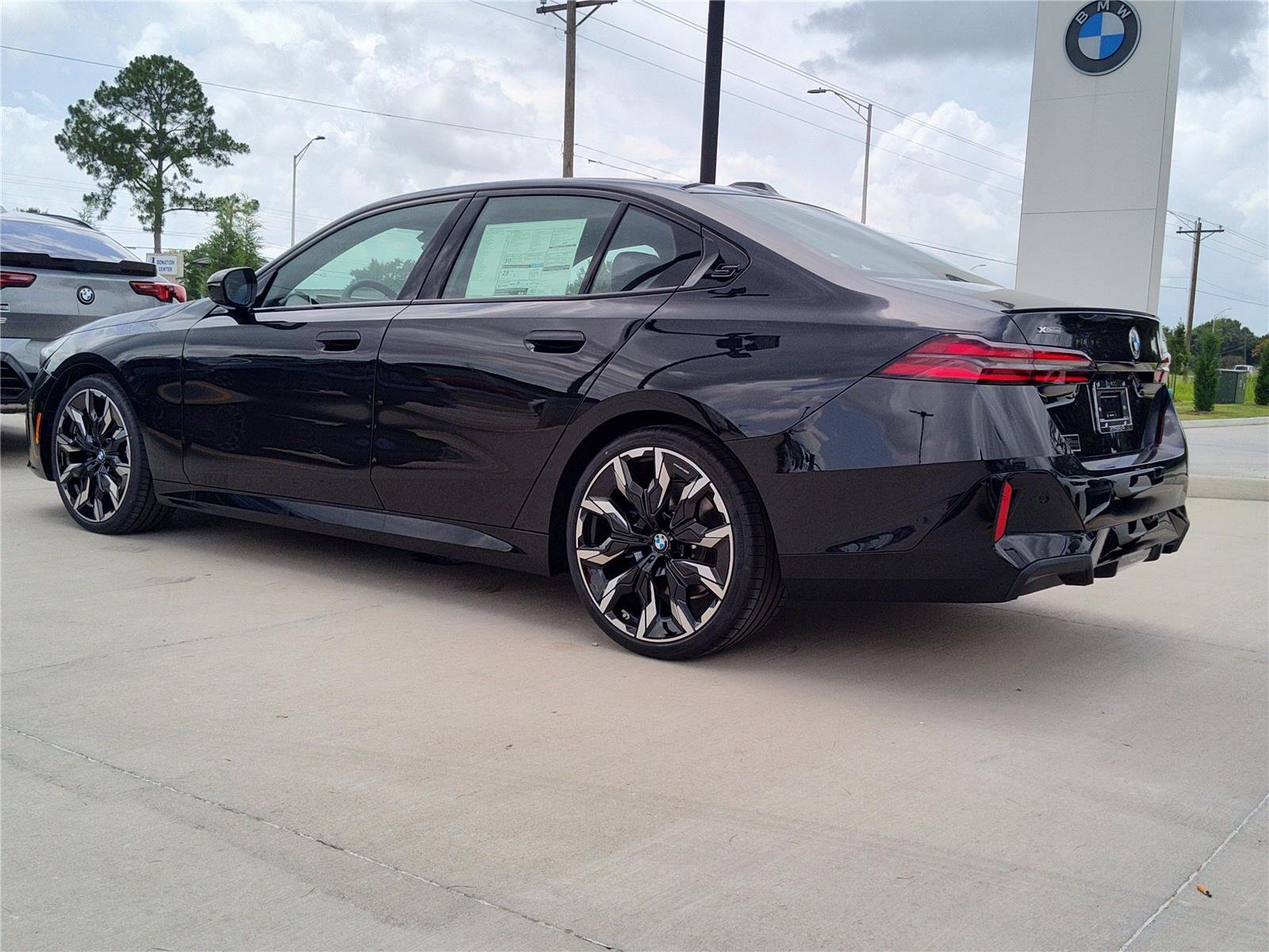 New 2027 Black Sapphire Metallic BMW 540i xDrive image 3