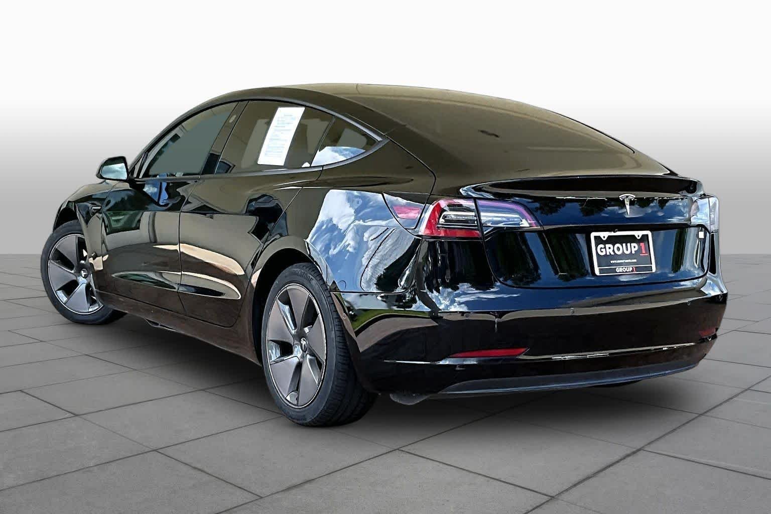 Used 2021 Solid Black Tesla Standard Range Plus image 9