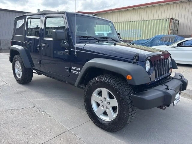 Used 2013 Blue Jeep Unlimited Sport image 1