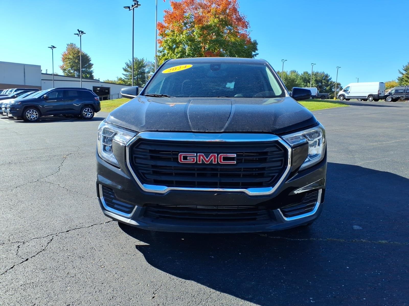 Used 2024 Ebony Twilight Metallic GMC SLE image 2