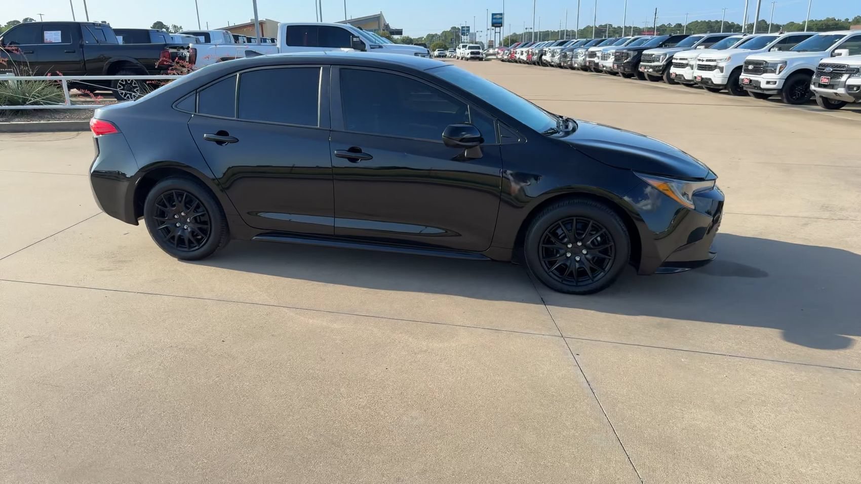Used 2024 Midnight Black Metallic Toyota LE image 2