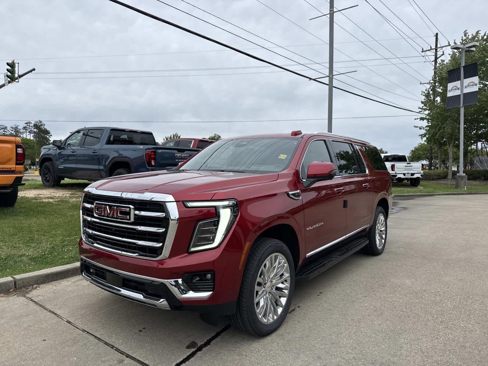 New 2026 Volcanic Red Tintcoat GMC Elevation image 3