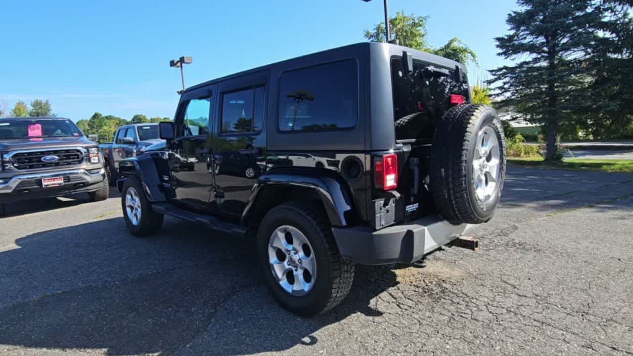 Used 2014 Black Clear Coat Jeep Sahara image 6