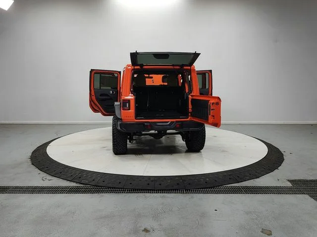 Used 2018 Orange Jeep Unlimited Sahara image 14