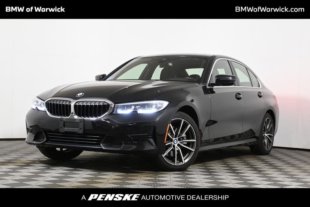 Used 2021 Black Sapphire Metallic BMW 330i xDrive image 1