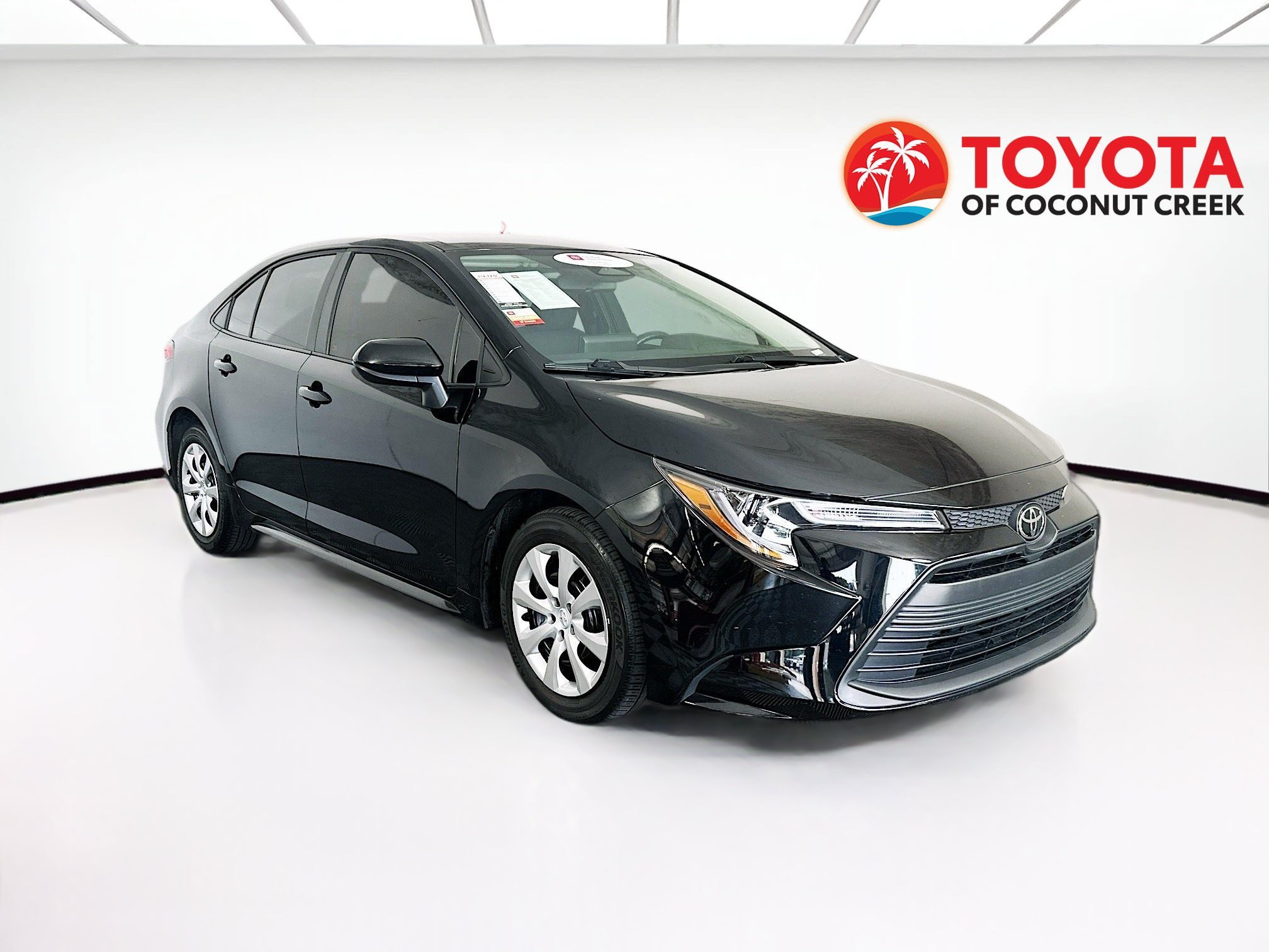 Certified Used 2025 Midnight Black Metallic Toyota LE image 1