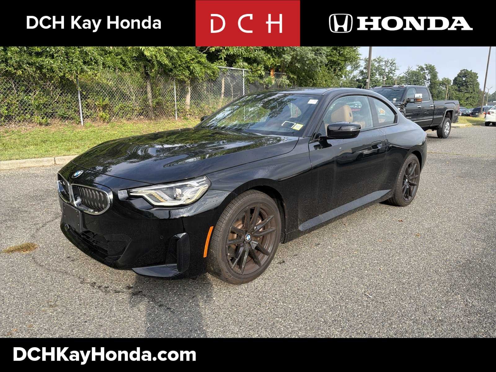 Used 2023 Jet Black BMW 230i xDrive image 1