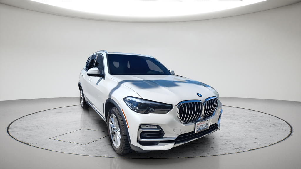 Used 2021 Mineral White Metallic BMW xDrive40i image 1