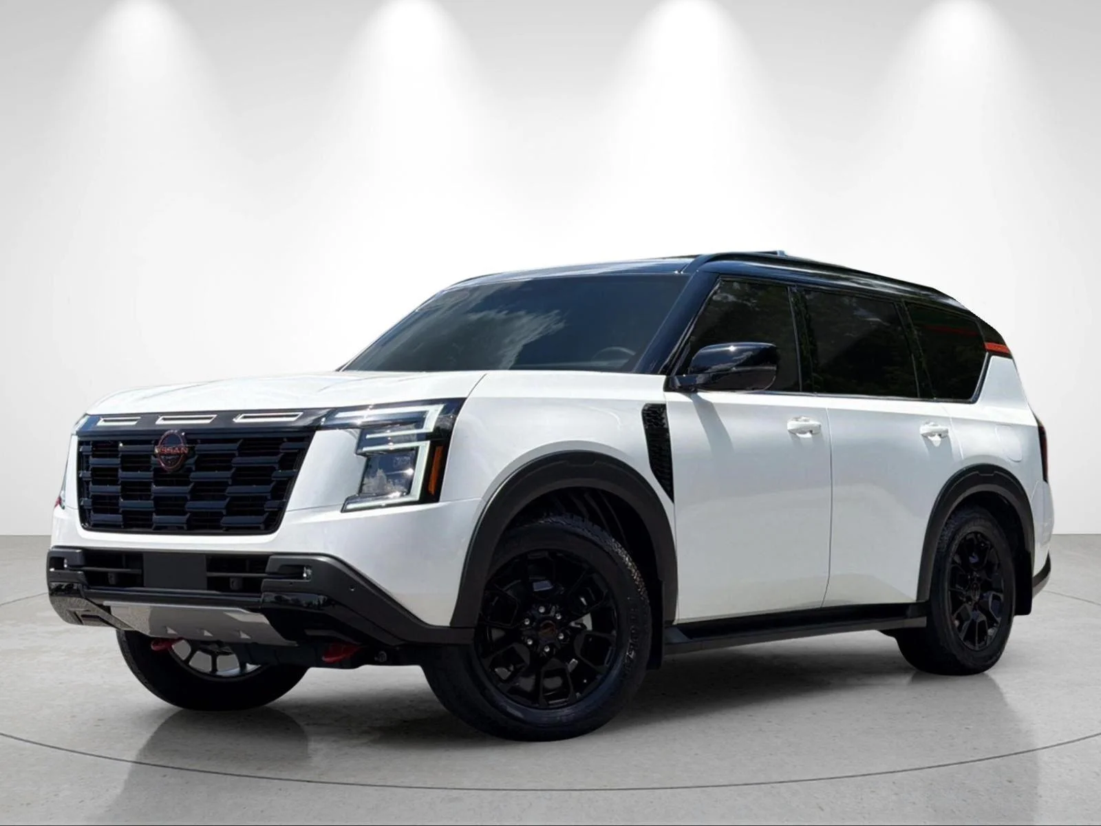 Used 2025 Aspen White Tricoat/Super Black Nissan PRO-4X image 1
