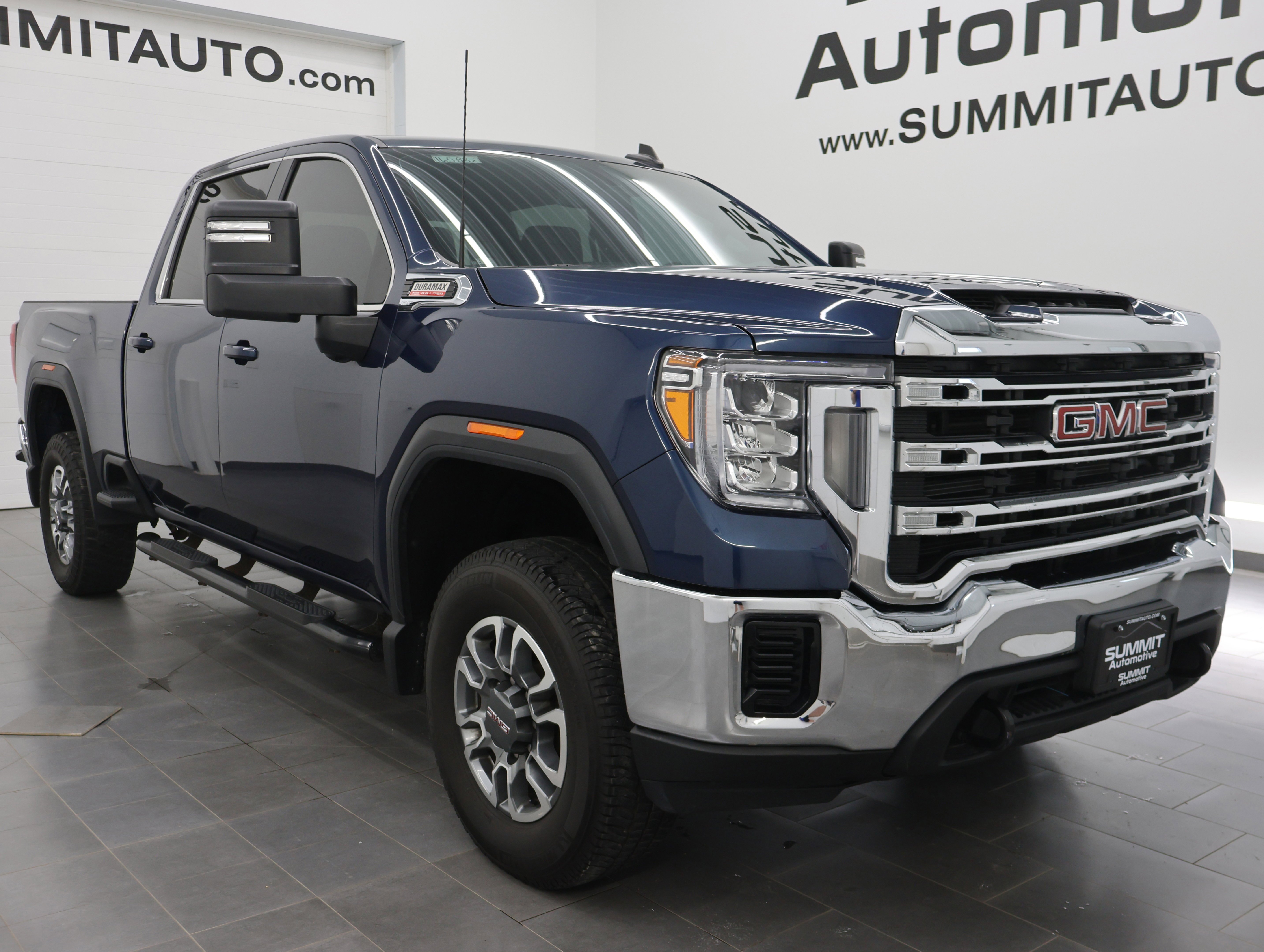 Used 2023 Pacific Blue Metallic GMC 4x4 Crew Cab SLE: CREW-SHORT-SLE-6.6L DIESEL-4WD-BACKUP CAM image 2
