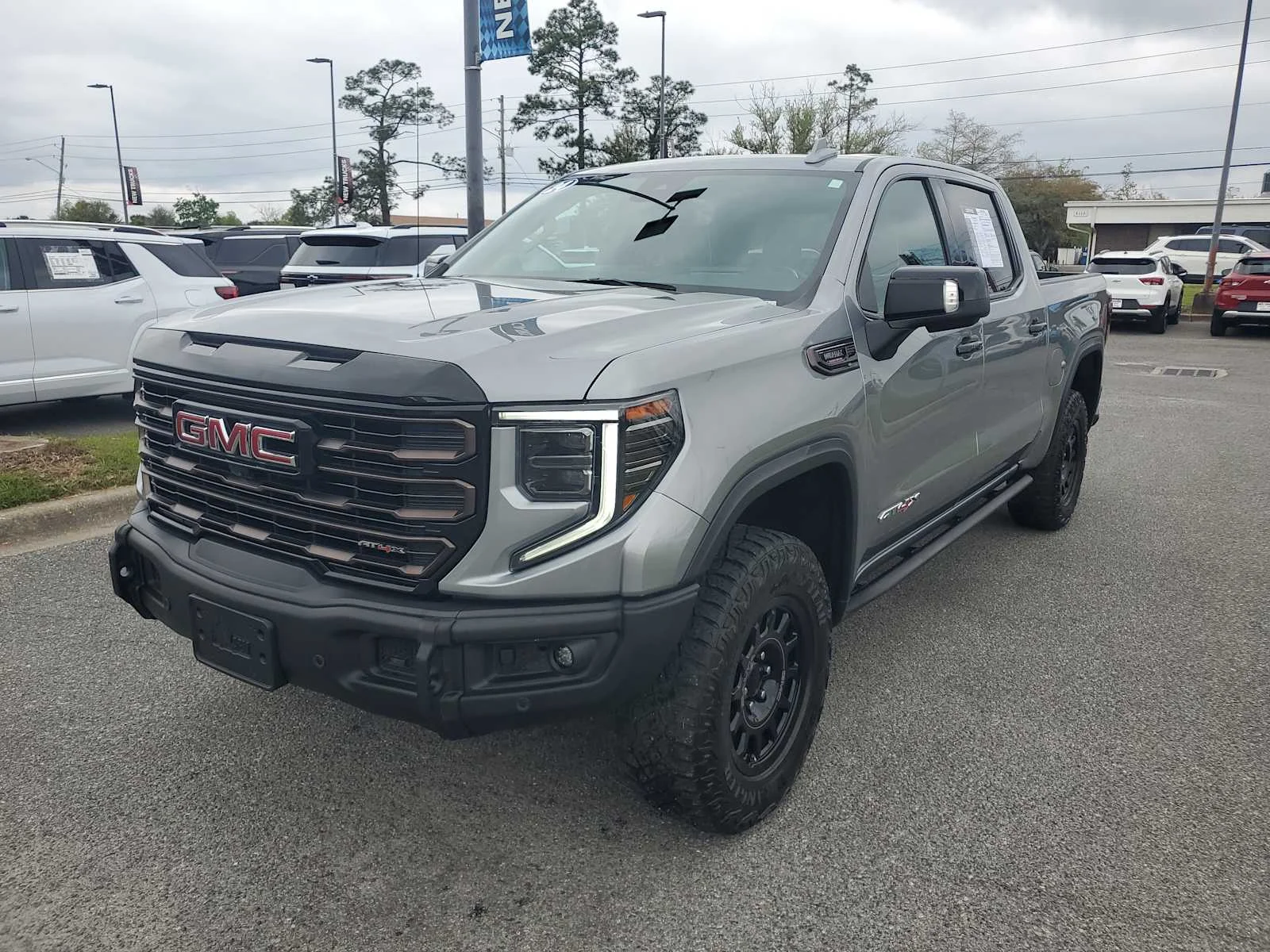 Used 2024 Sterling Metallic GMC AT4X image 1
