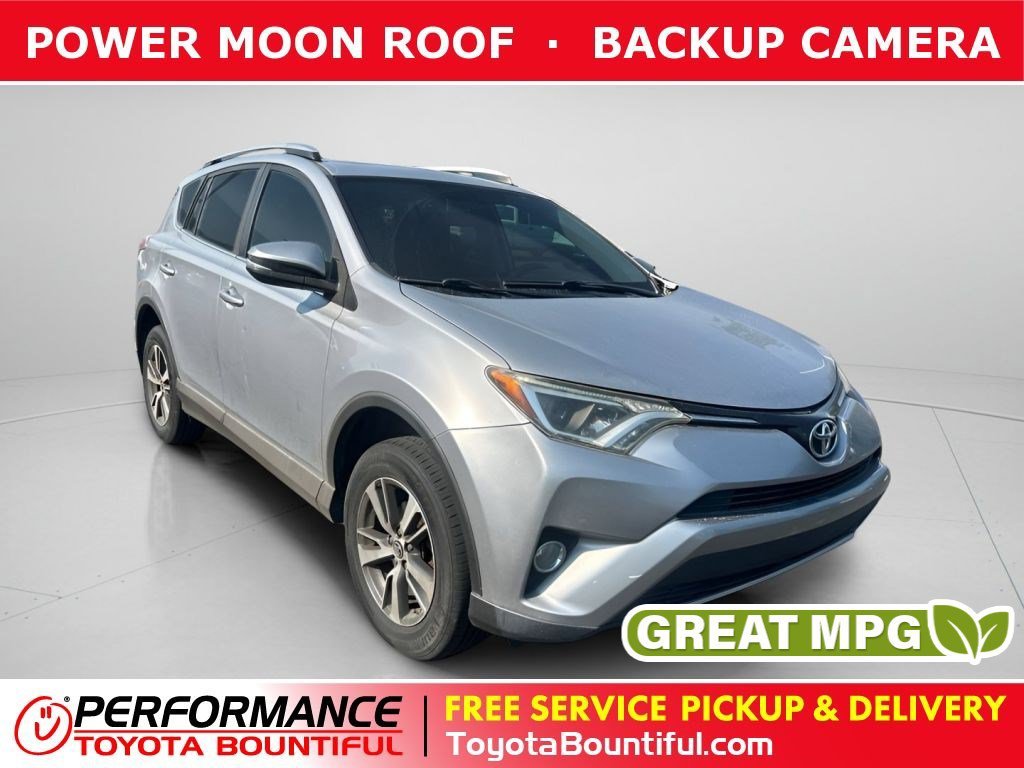 Used 2016 Silver Sky Metallic Toyota XLE image 1