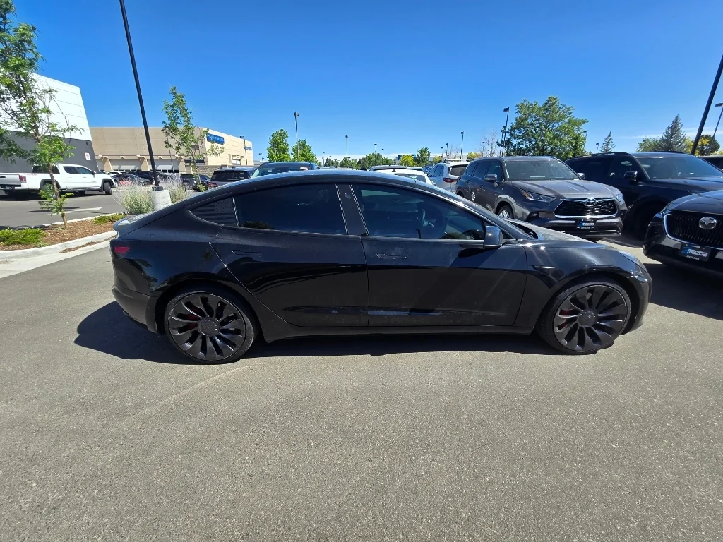 Used 2022 Solid Black Tesla Performance image 6