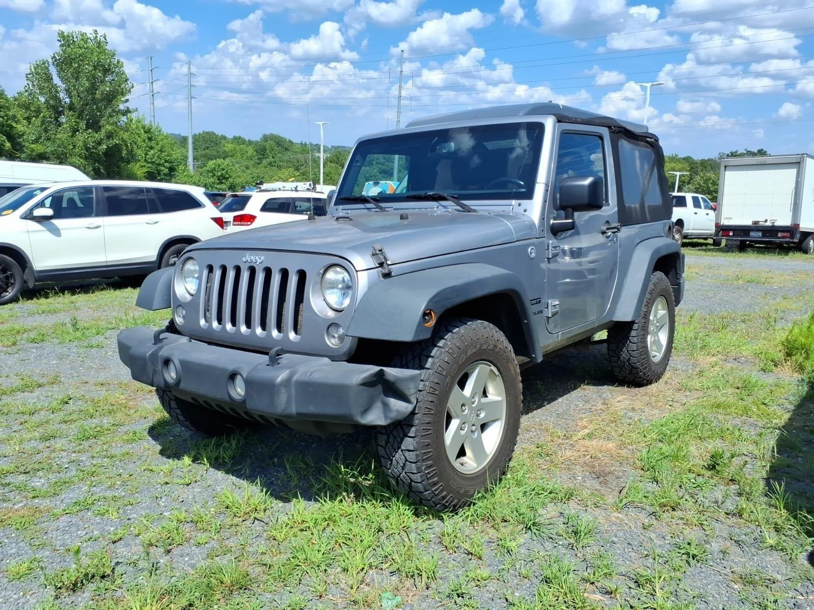 Used 2015 Billet Silver Metallic Clearcoat Jeep Sport image 1