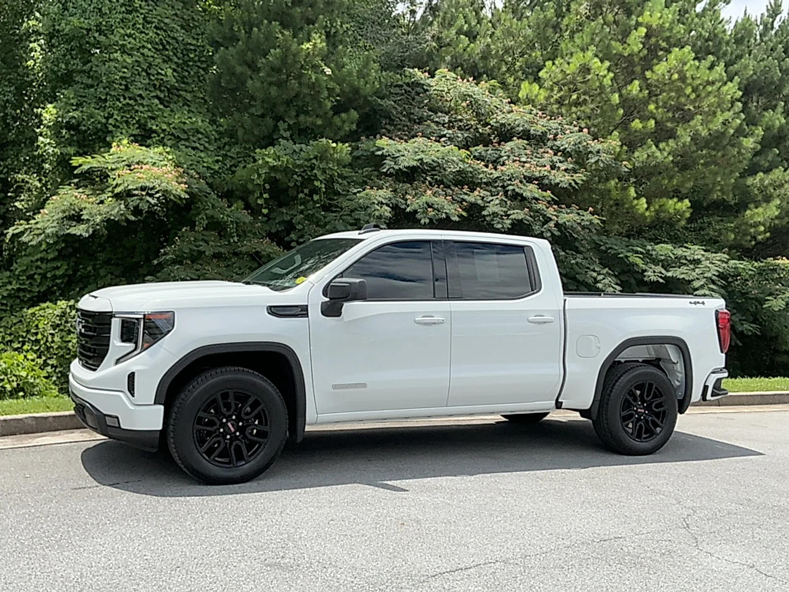 Used 2024 Summit White GMC 4WD Crew Cab Short Box Elevation with 3SB image 4