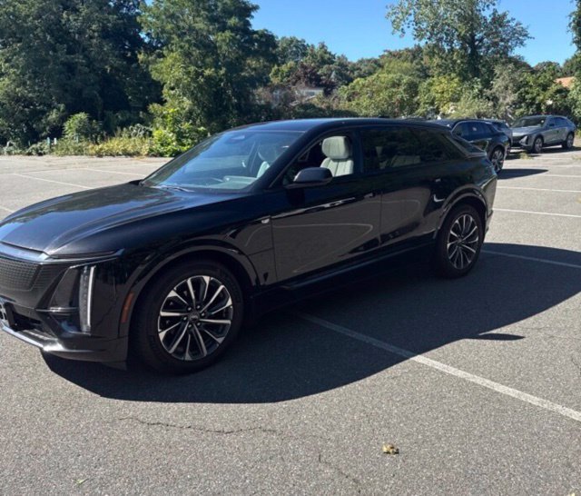 Used 2024 Stellar Black Metallic Cadillac Sport 1 image 1
