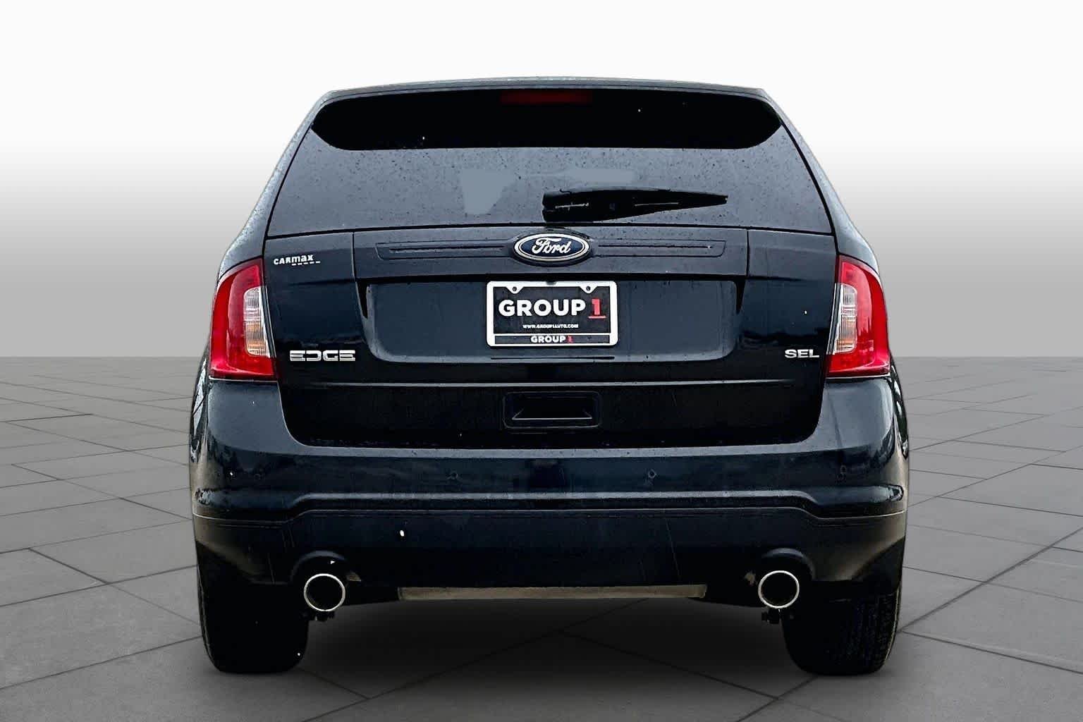 Used 2013 Tuxedo Black Metallic Ford SEL image 4