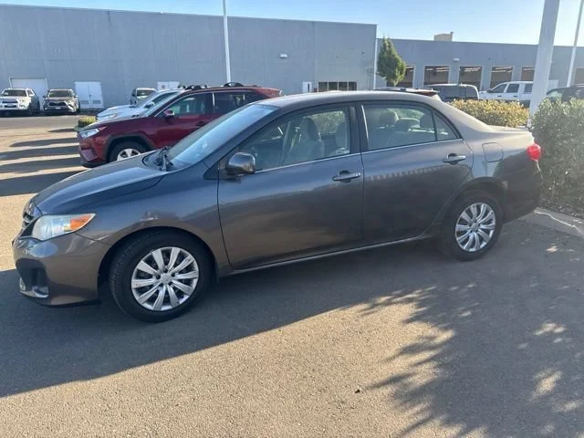 Used 2013 Magnetic Gray Metallic Toyota LE image 1