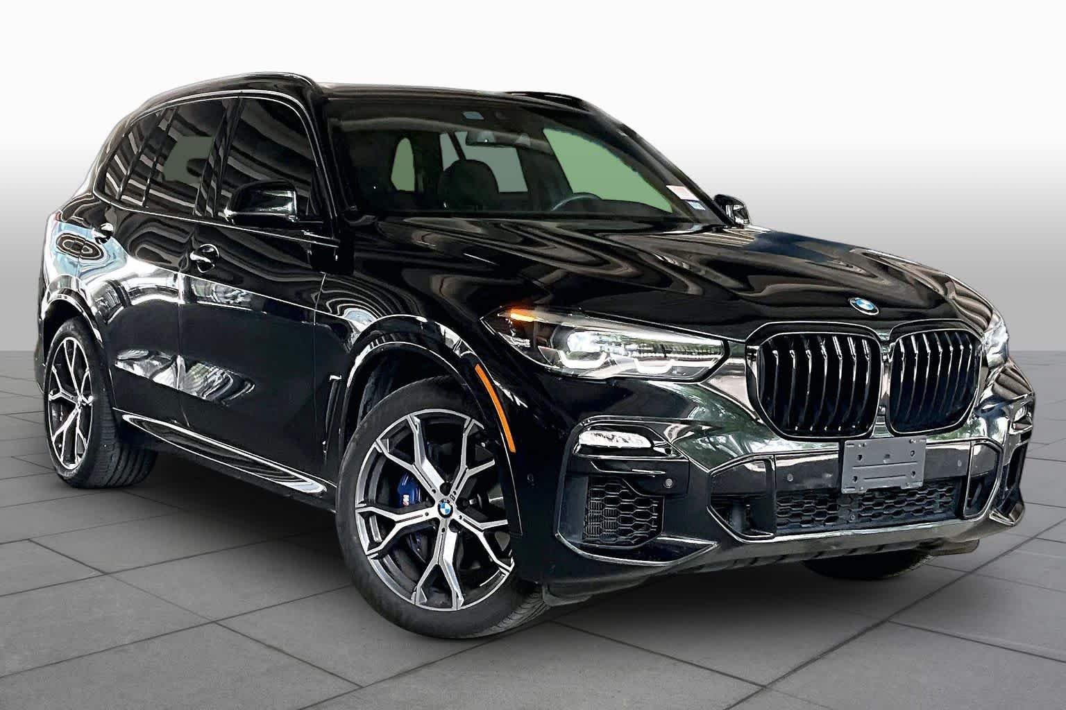 Used 2021 Black Sapphire Metallic BMW sDrive40i image 2