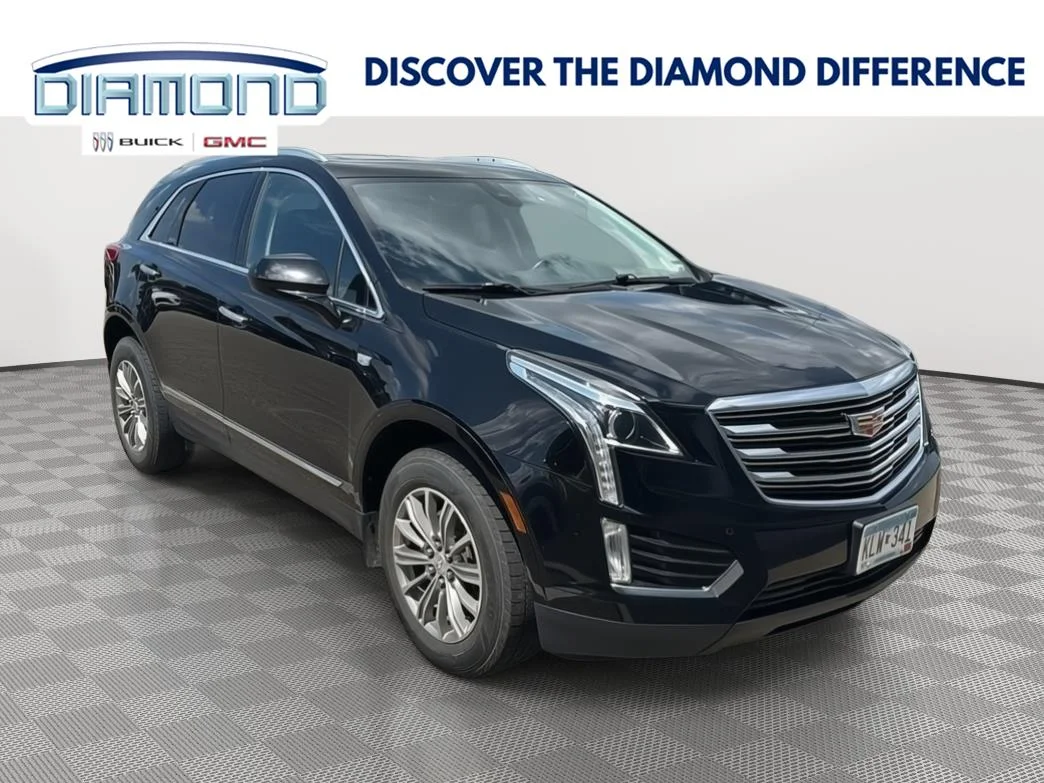 Used 2017 STELLAR BLACK METALLIC Cadillac Luxury FWD image 1