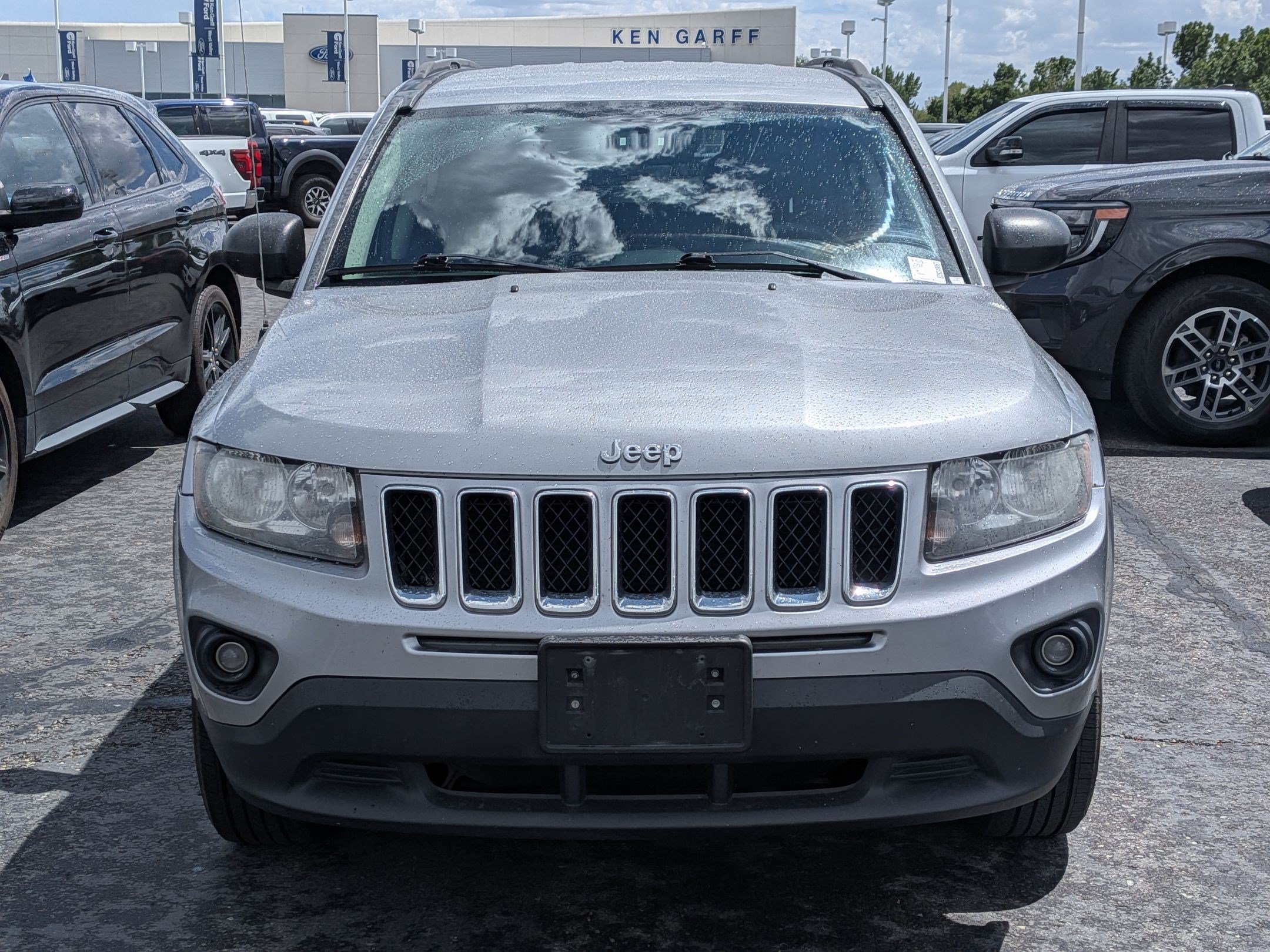 Used 2014 Billet Silver Clearcoat Metallic Jeep Sport image 9