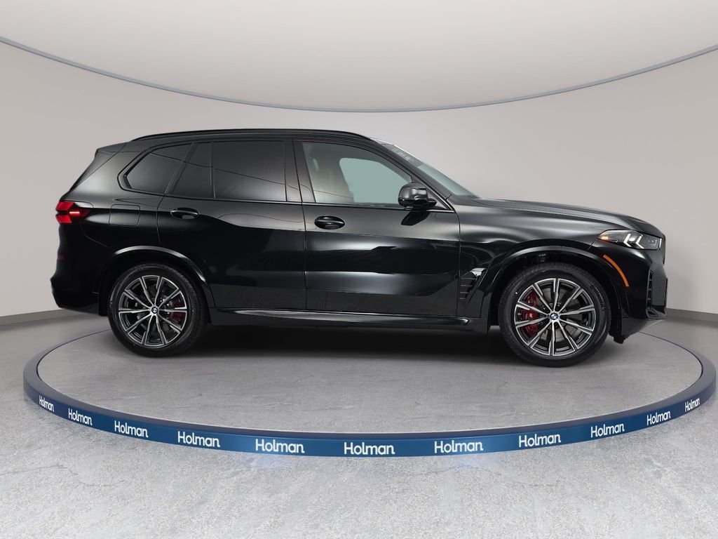 New 2026 Black Sapphire Metallic BMW xDrive50e image 4