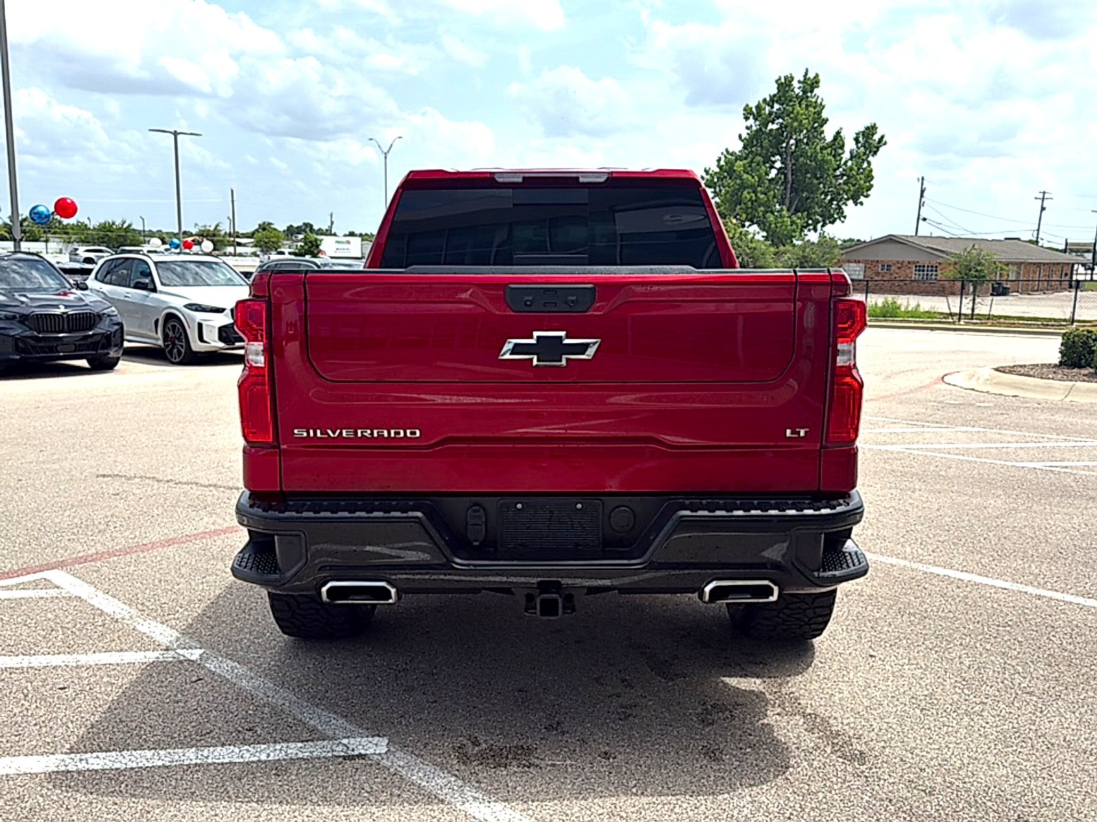 Used 2025 Radiant Red Tintcoat Chevrolet 4WD Crew Cab Short Bed LT Trail Boss image 6
