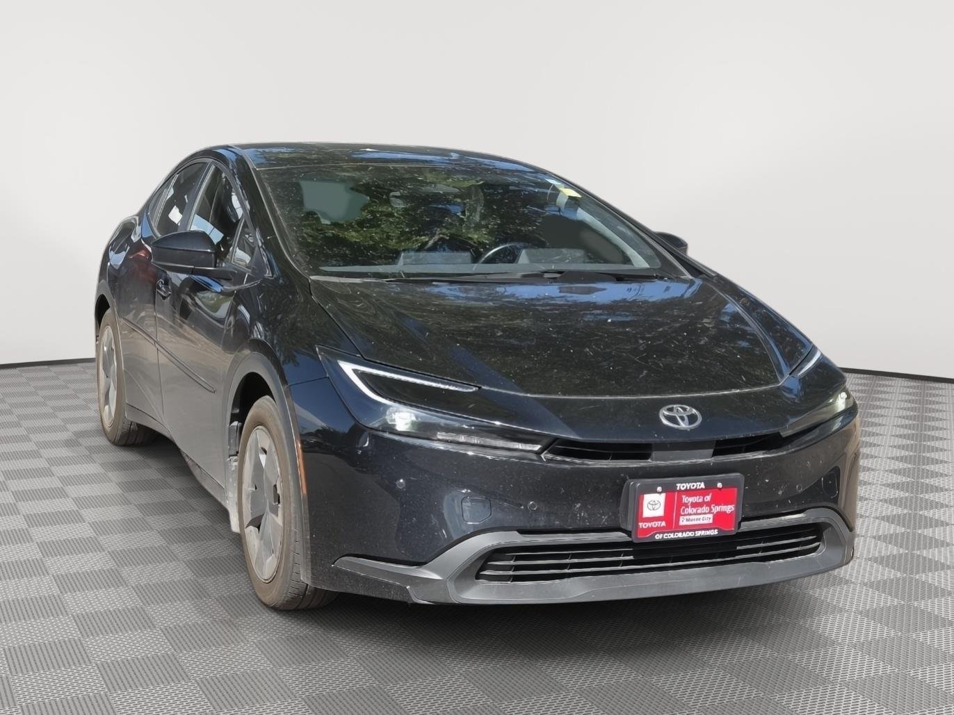 Used 2024 Midnight Black Metallic Toyota LE image 1