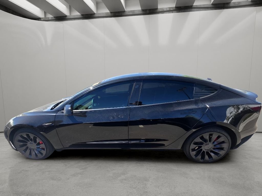 Used 2022 Solid Black Tesla Performance image 4