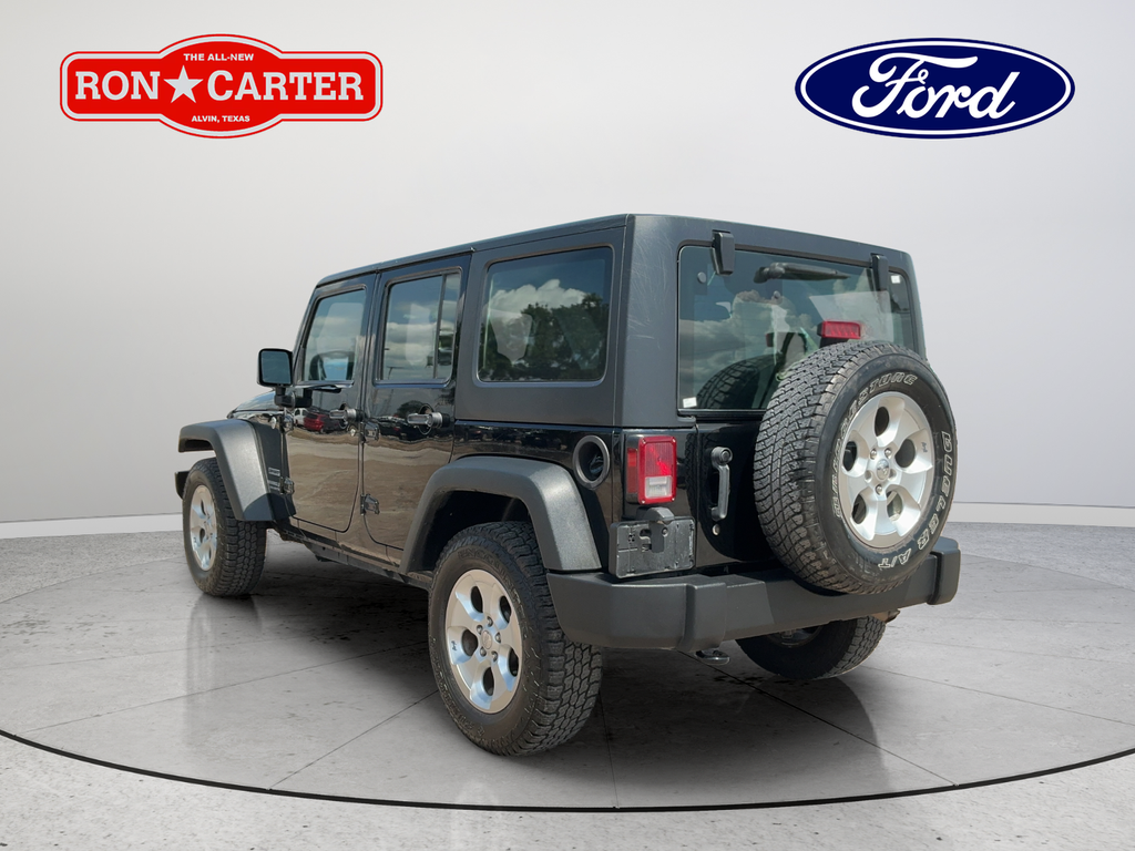 Used 2013 Black Jeep Unlimited Sport image 4