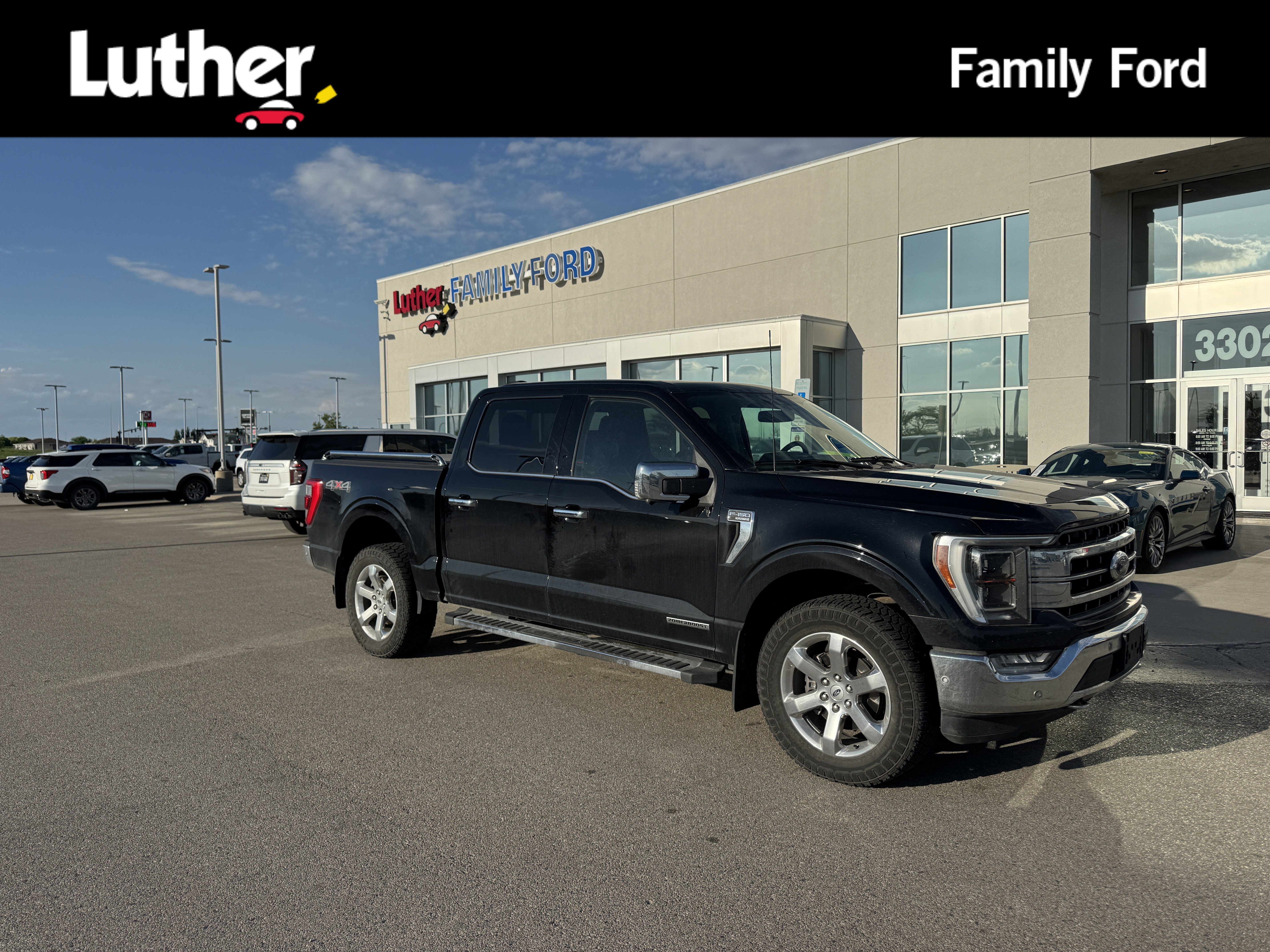 Used 2021 Agate Black Metallic Ford LARIAT image 1