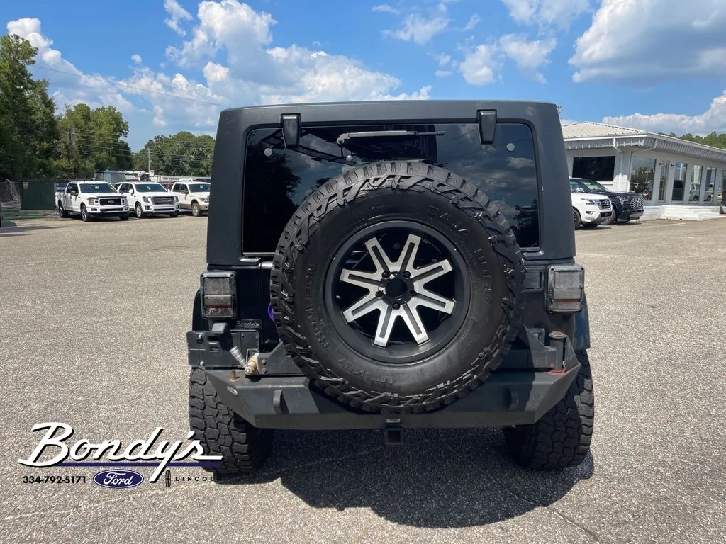 Used 2013 Black Clearcoat Jeep Unlimited Sport image 13
