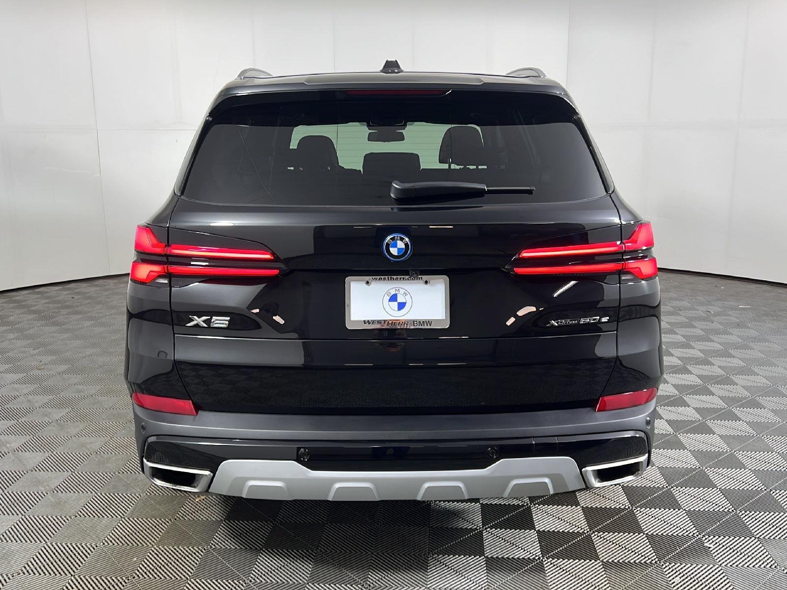 New 2026 Black Sapphire Metallic BMW xDrive50e image 4