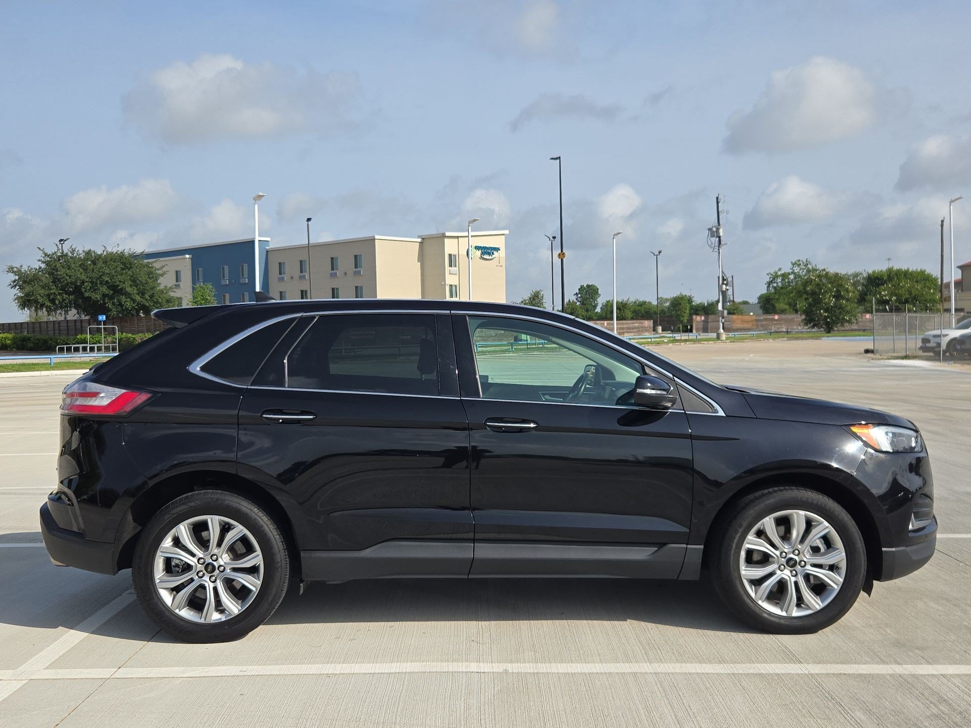 Used 2024 Black Metallic Ford Titanium image 2