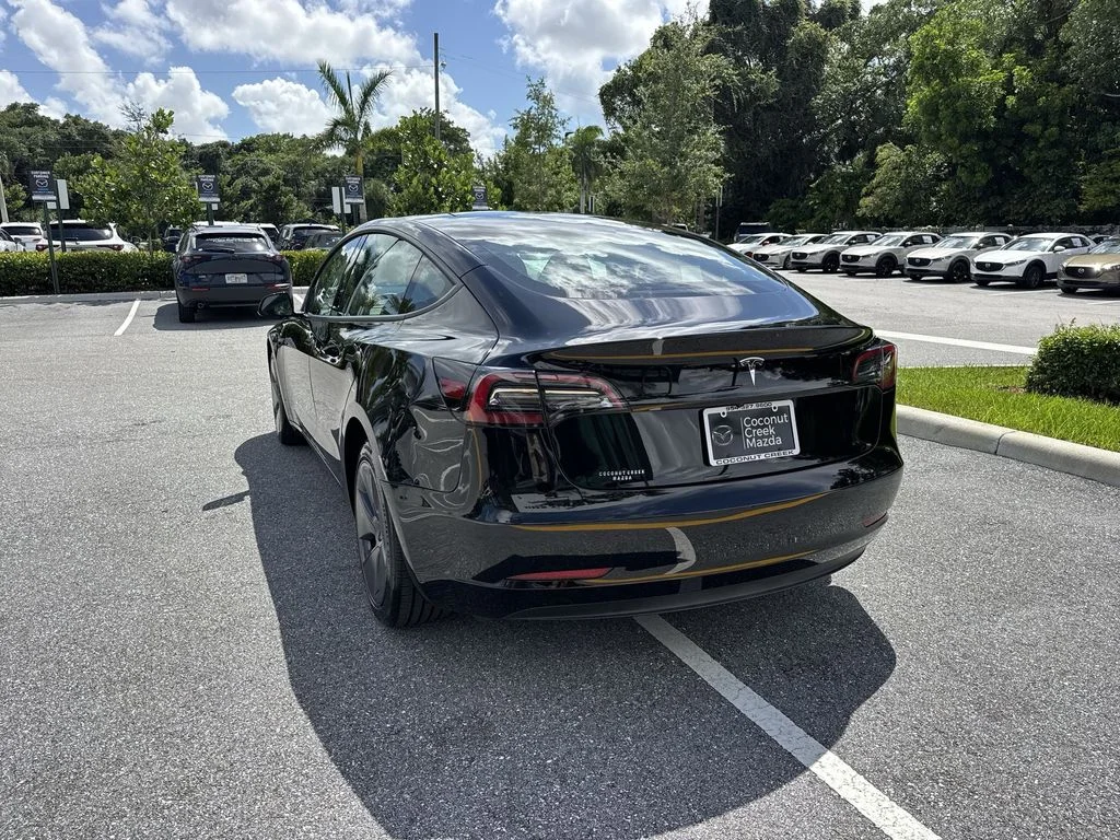 Used 2023 Solid Black Tesla  image 13