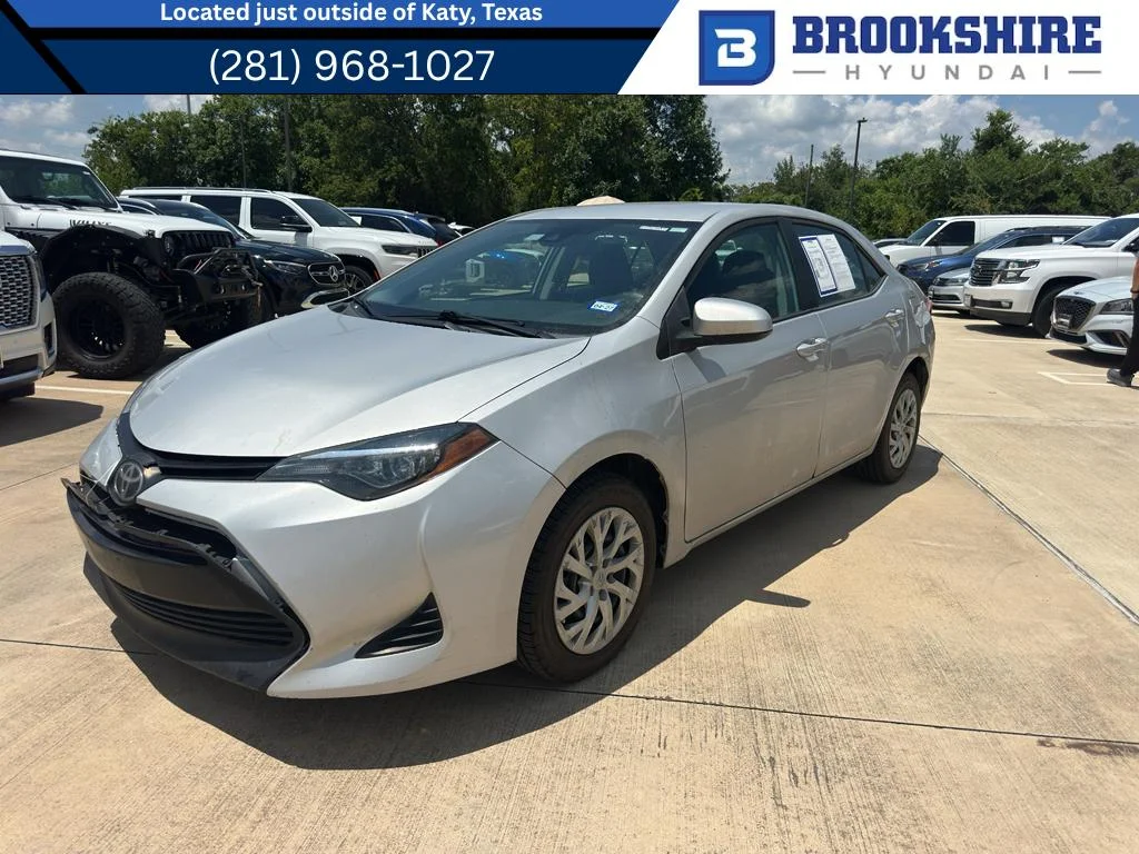 Used 2019 Classic Silver Metallic Toyota LE image 1