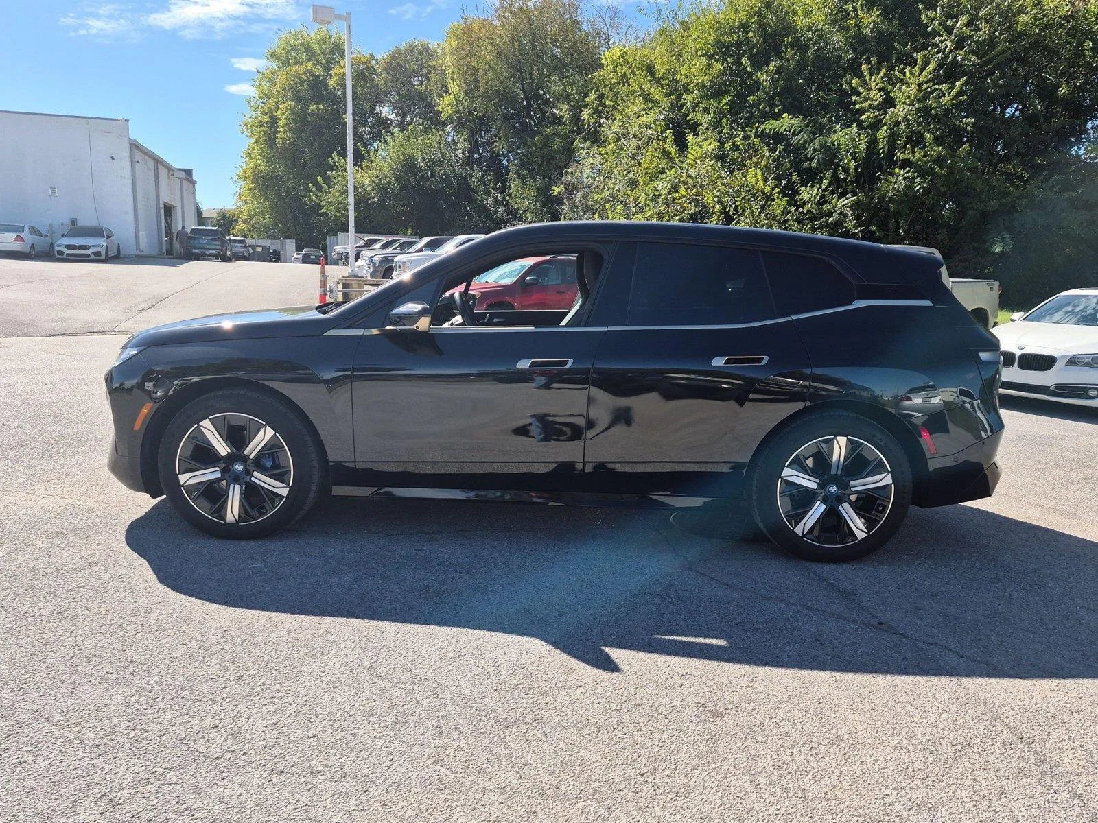 Used 2024 Black Sapphire Metallic BMW xDrive50 image 2