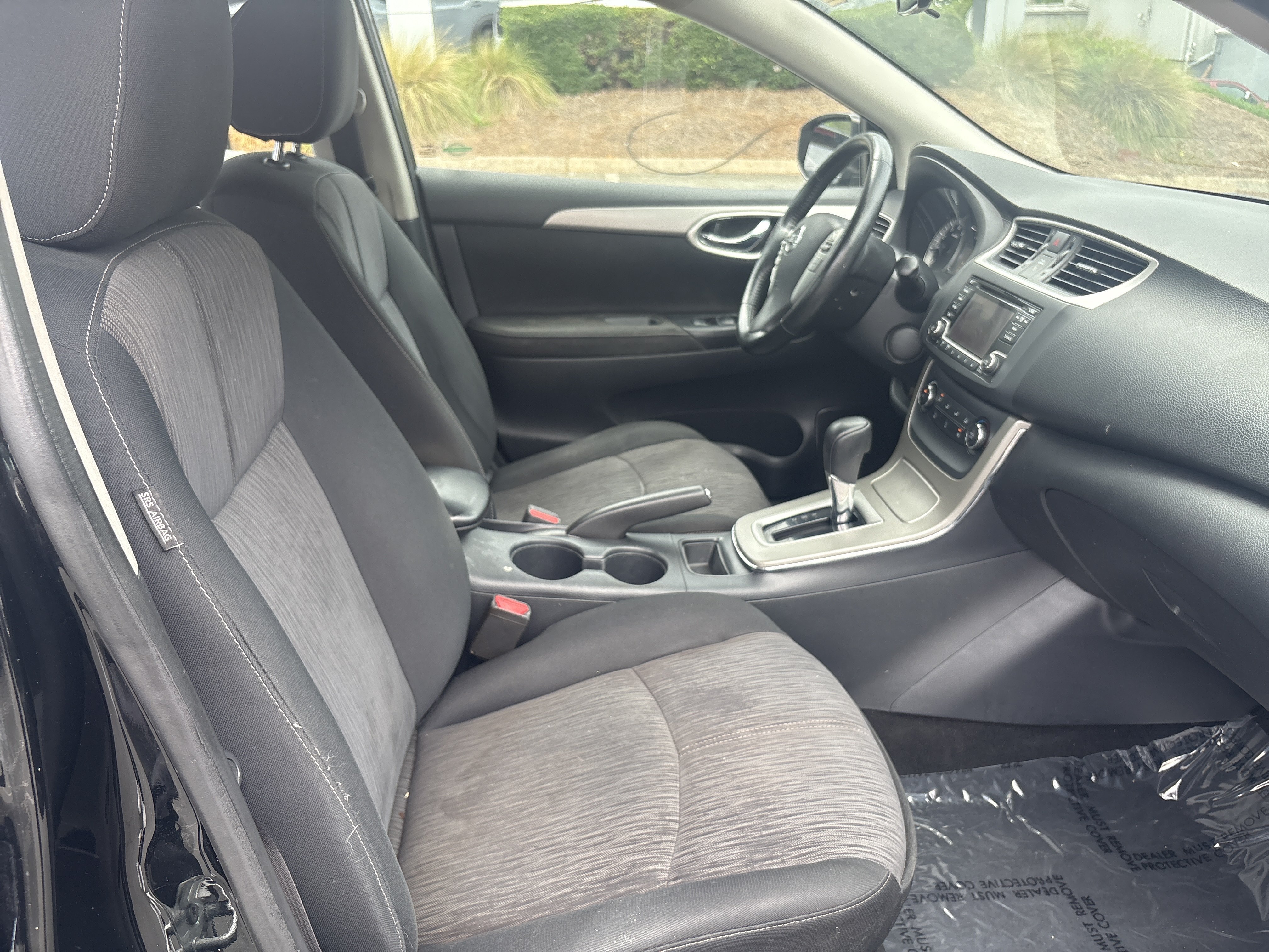 Used 2015 Super Black Nissan SV image 13