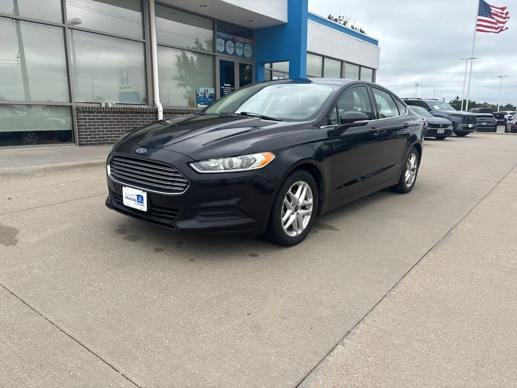 Used 2014 Tuxedo Black Metallic Ford SE image 1