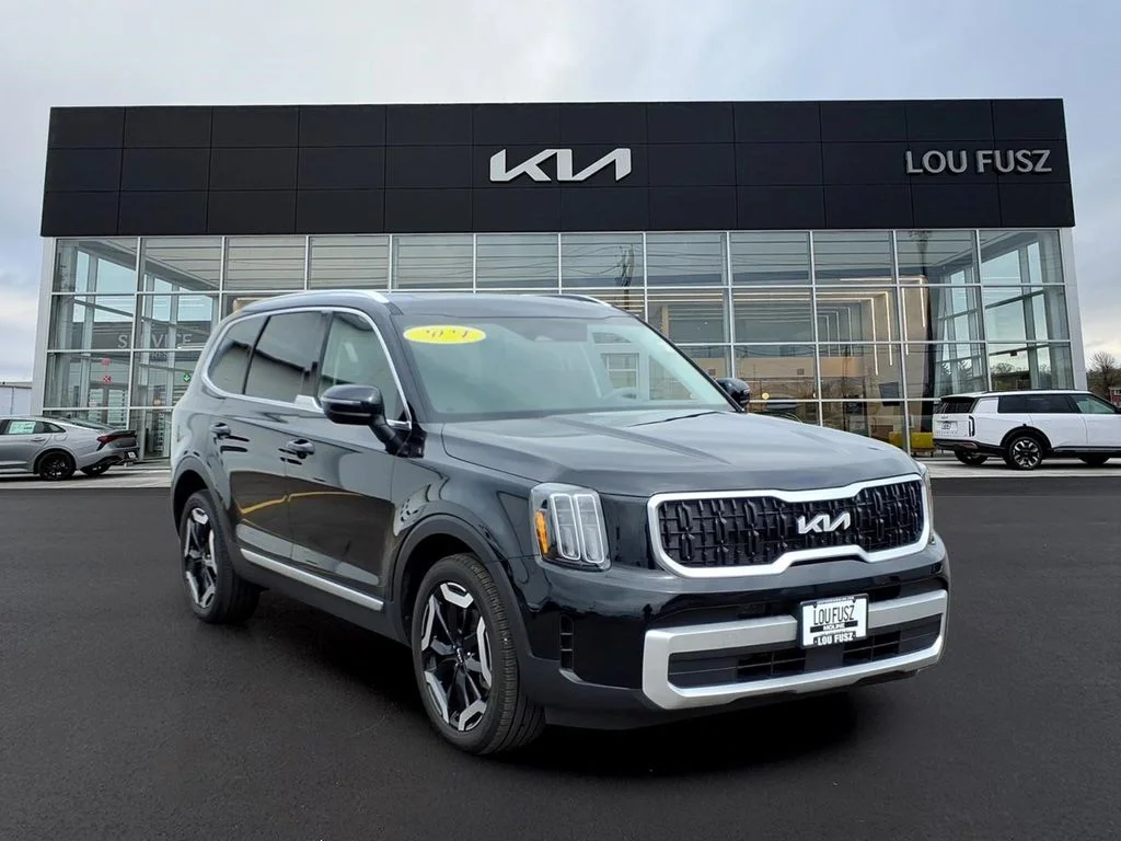 Used 2024 Black Kia EX image 1