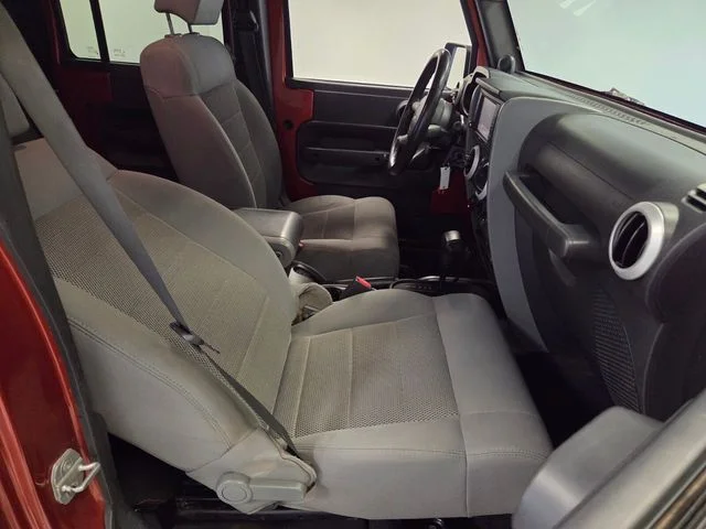 Used 2009 Orange Jeep Unlimited Sahara image 15
