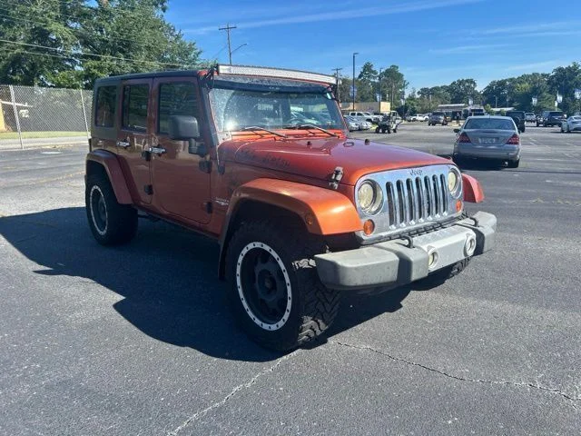 Used 2009 Orange Jeep Unlimited Sahara image 6