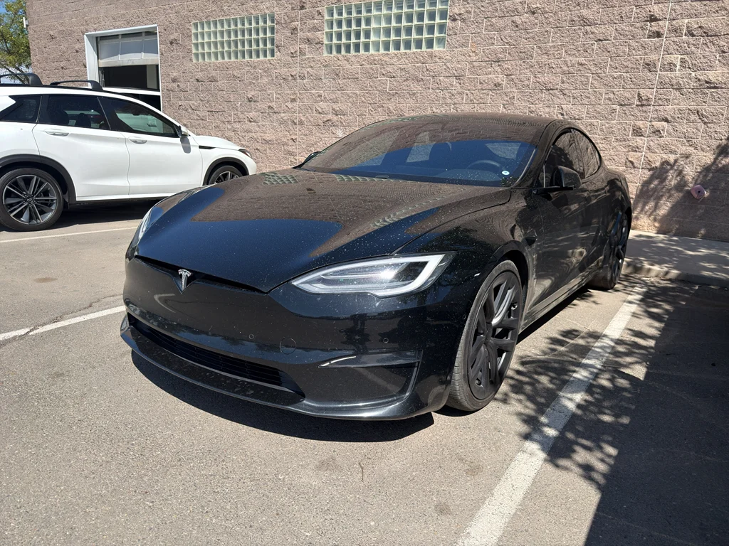 Used 2022 Solid Black Tesla Plaid image 1