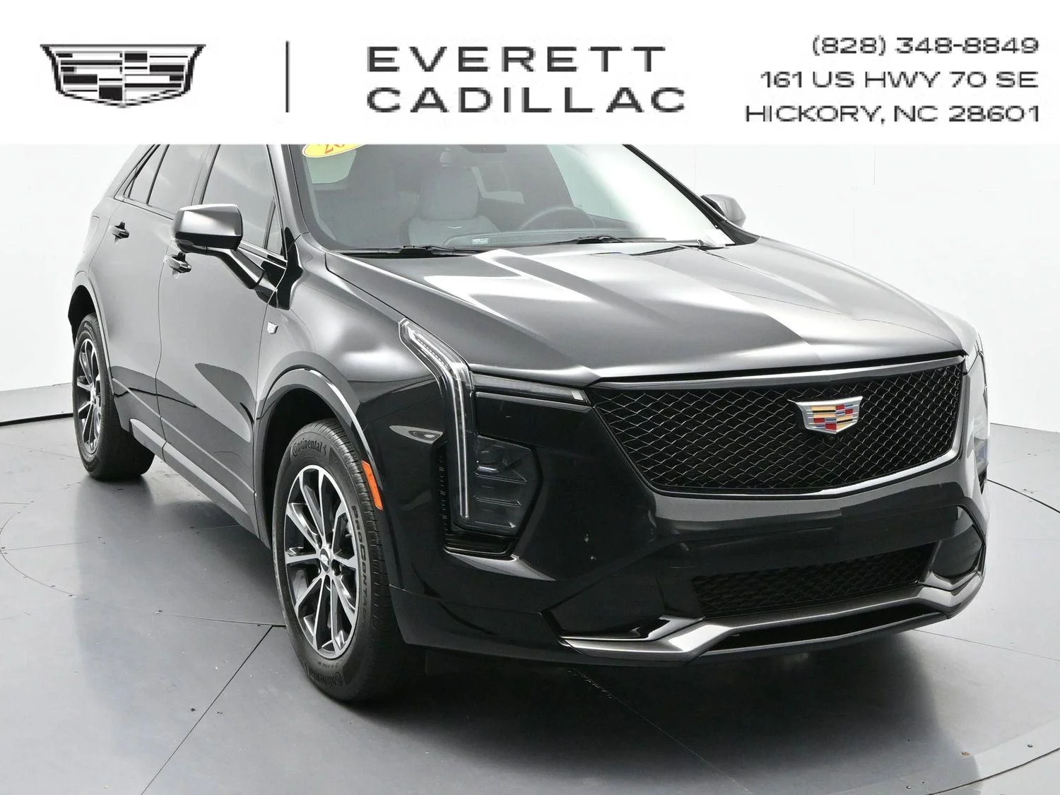 Used 2024 Stellar Black Metallic Cadillac Sport image 1