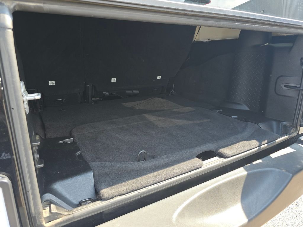 Used 2013 Black Jeep Unlimited Sport image 21