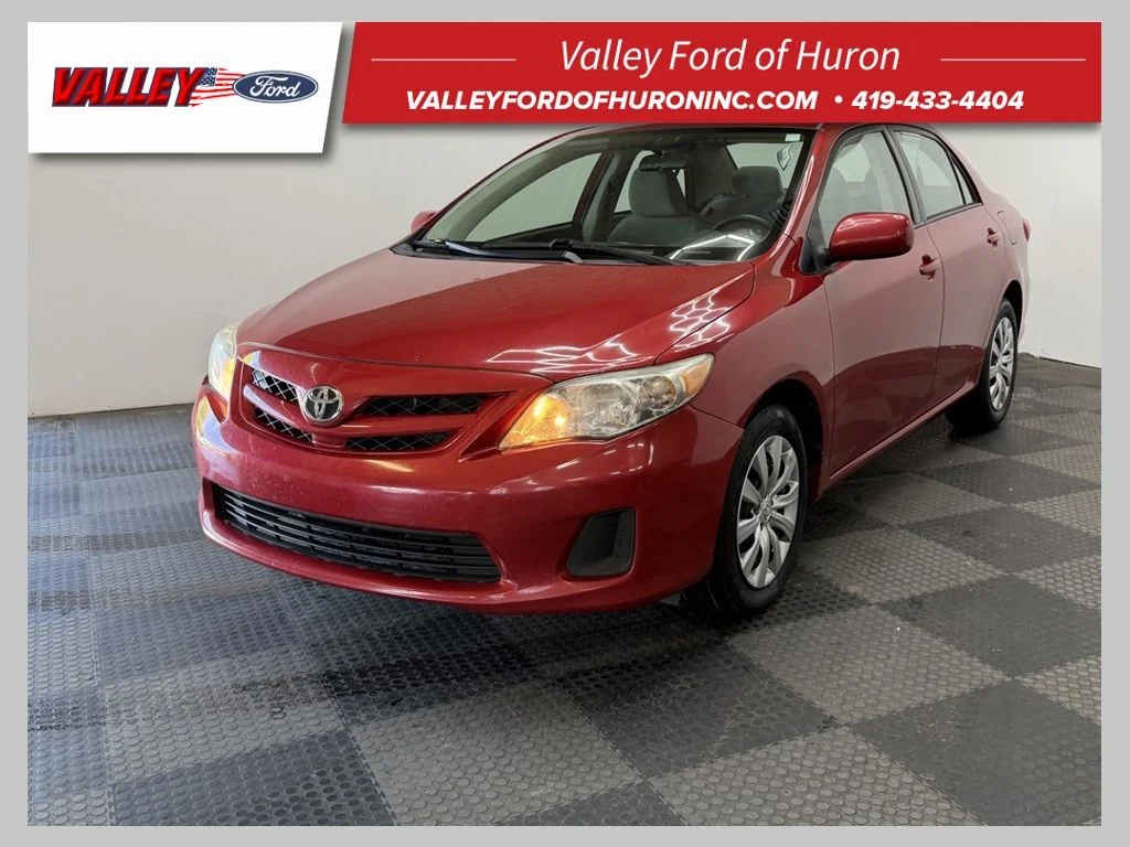 Used 2012 Barcelona Red Metallic Toyota LE image 1
