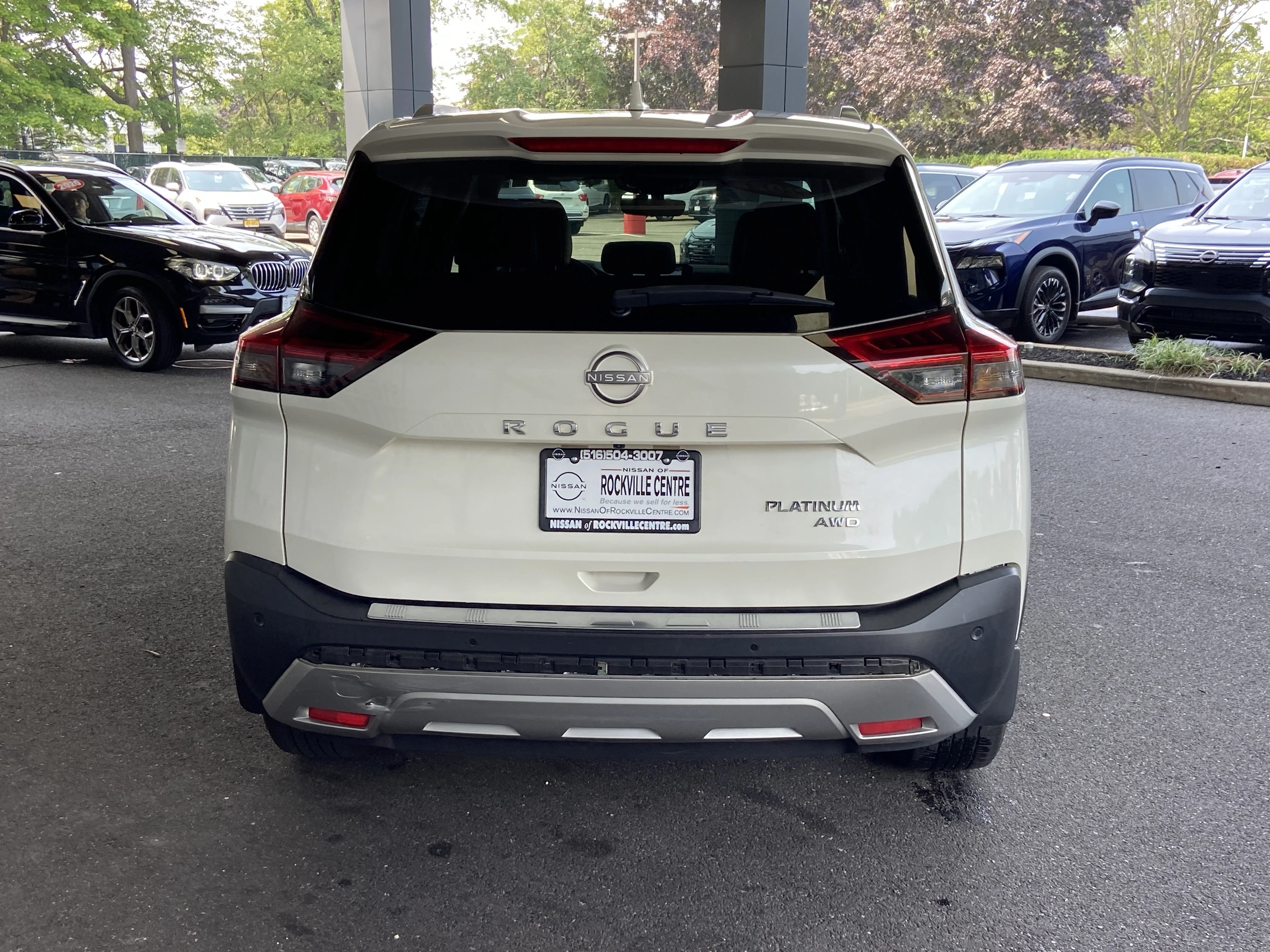 Used 2022 Pearl White Tricoat Nissan  image 1