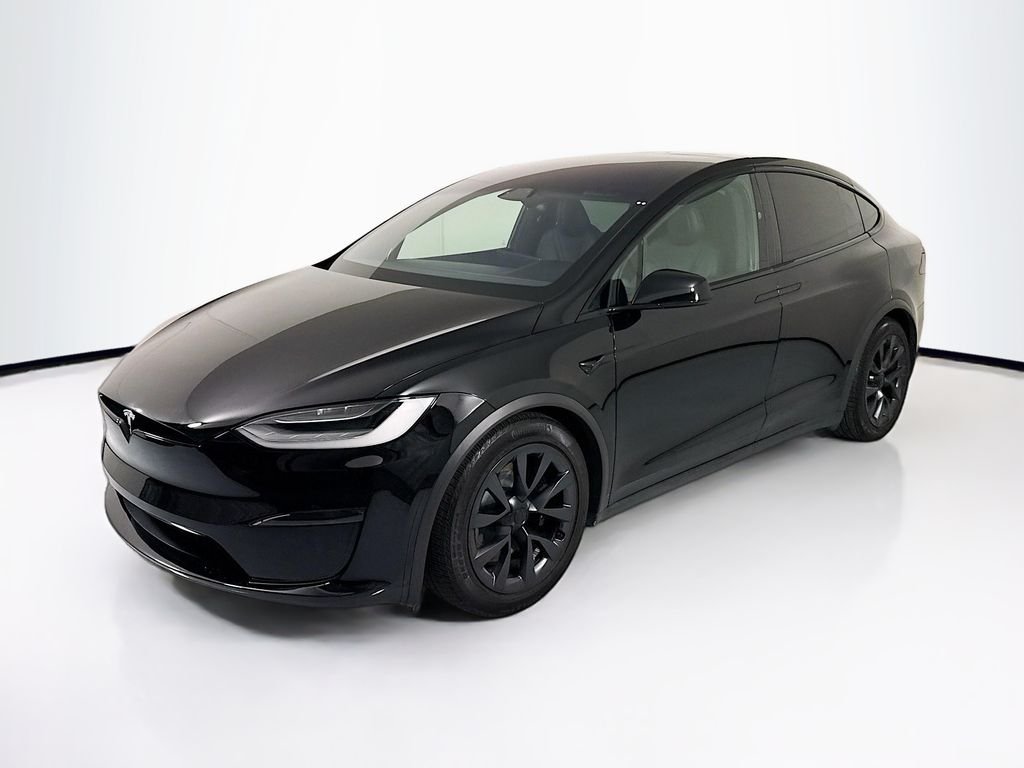Used 2023 Solid Black Tesla  image 1
